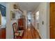 Spacious hallway with hardwood floors, displaying elegant decor and bright lighting at 17606 Lee Ave, Redington Shores, FL 33708