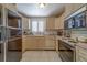 Functional kitchen featuring a classic layout with tiled flooring at 17606 Lee Ave, Redington Shores, FL 33708