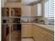 Functional kitchen with retro appliances and light wood cabinetry at 17606 Lee Ave, Redington Shores, FL 33708