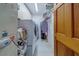 Organized laundry room equipped with a washer, dryer, and ample storage space at 17606 Lee Ave, Redington Shores, FL 33708