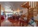 Open living area with hardwood floors, spiral staircase, and access to panoramic ocean views at 17606 Lee Ave, Redington Shores, FL 33708