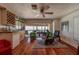 Bright living area with an exercise bike, wine rack and gorgeous ocean views from the large windows at 17606 Lee Ave, Redington Shores, FL 33708