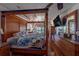 Luxurious main bedroom with a four-poster bed, hardwood floors, and ocean view balcony access at 17606 Lee Ave, Redington Shores, FL 33708