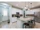 Inviting kitchen with stainless appliances, granite island, and lots of cabinet space at 17847 Althea Blue Pl, Lutz, FL 33558