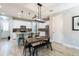 Open concept kitchen boasts granite countertops, stainless appliances, and a breakfast bar at 17847 Althea Blue Pl, Lutz, FL 33558