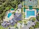 Aerial view of community amenities, including pools, tennis courts, and clubhouse at 18002 Avalon Ln, Tampa, FL 33647