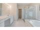 Bathroom with a shower, bath, and walk-in closet at 18002 Avalon Ln, Tampa, FL 33647