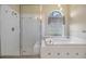 Bathroom with large tub, glass shower, and tiled walls at 18002 Avalon Ln, Tampa, FL 33647