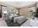 A serene bedroom with a tufted headboard bed, soft lighting, and stylish décor at 18002 Avalon Ln, Tampa, FL 33647