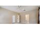 Neutral bedroom features access to backyard through sliding glass doors at 18002 Avalon Ln, Tampa, FL 33647