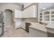 Beautiful kitchen with white cabinetry, stainless steel appliances, and tiled backsplash at 18002 Avalon Ln, Tampa, FL 33647