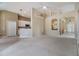 Expansive living area with arched doorways and an open view into the kitchen at 18002 Avalon Ln, Tampa, FL 33647