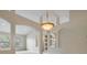 Living room featuring arched doorways, high ceilings, and a large chandelier at 18002 Avalon Ln, Tampa, FL 33647
