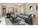 Bright living room with neutral colors, elegant furniture, and dining area in an open-concept design at 18002 Avalon Ln, Tampa, FL 33647