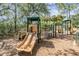 Community playground featuring slides and climbing structures for recreation at 18002 Avalon Ln, Tampa, FL 33647
