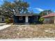 Lovely one-story home showcasing a cozy porch and neat landscaping, complemented by a sunny day at 1931 44Th S St, St Petersburg, FL 33711