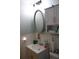 Modest bathroom features a vanity sink, mirrored medicine cabinet, and standard toilet at 2020 World Parkway Blvd # 12, Clearwater, FL 33763