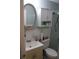 Cozy bathroom features a vanity sink, mirrored medicine cabinet, and standard toilet at 2020 World Parkway Blvd # 12, Clearwater, FL 33763