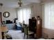 A comfortable bedroom with tile flooring, ceiling fan and natural light at 2020 World Parkway Blvd # 12, Clearwater, FL 33763