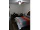 Bedroom featuring hardwood floors, ceiling fan and comfortable furniture at 2020 World Parkway Blvd # 12, Clearwater, FL 33763