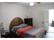 Bedroom with hardwood floors and cozy bedding at 2020 World Parkway Blvd # 12, Clearwater, FL 33763