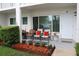 Charming front porch features colorful plants, comfortable seating, and a welcoming entrance at 2020 World Parkway Blvd # 12, Clearwater, FL 33763