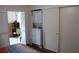 Bedroom hallway with closet, stacked washer and dryer and hardwood flooring at 2020 World Parkway Blvd # 12, Clearwater, FL 33763