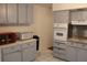 Functional kitchen features updated appliances, neutral cabinets, and ample countertop space at 2020 World Parkway Blvd # 12, Clearwater, FL 33763