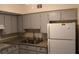 Functional kitchen features updated appliances, neutral cabinets, and ample countertop space at 2020 World Parkway Blvd # 12, Clearwater, FL 33763