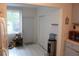 Bright kitchen featuring a view to the yard, stainless steel refrigerator, and tile flooring at 2020 World Parkway Blvd # 12, Clearwater, FL 33763