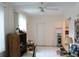 Bright living room with tile floors, ceiling fan, and view of the kitchen area at 2020 World Parkway Blvd # 12, Clearwater, FL 33763