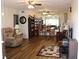 Spacious living room with hardwood floors, ceiling fans and plenty of natural light at 2020 World Parkway Blvd # 12, Clearwater, FL 33763