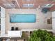 Aerial view of community pool and courtyard with outdoor seating, offering a refreshing and social atmosphere at 219 4Th N Ave # 201, St Petersburg, FL 33701