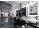 Modern bathroom featuring black marble finishes, updated lighting fixtures and sleek, contemporary fixtures at 219 4Th N Ave # 201, St Petersburg, FL 33701