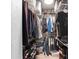 Organized walk-in closet providing ample storage with shelving and racks for clothing and shoe organization at 219 4Th N Ave # 201, St Petersburg, FL 33701