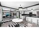 The dining area features unique black and white flooring and decor with clear chairs surrounding the table at 219 4Th N Ave # 201, St Petersburg, FL 33701