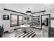 Bright dining room features a black and white motif, a round table with seating and a wall mirror at 219 4Th N Ave # 201, St Petersburg, FL 33701