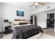 A spacious main bedroom with a ceiling fan and natural light at 219 4Th N Ave # 201, St Petersburg, FL 33701