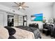 Sleek main bedroom featuring a ceiling fan, decorative artwork and modern, minimalist furnishings at 219 4Th N Ave # 201, St Petersburg, FL 33701