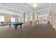 Expansive recreation room featuring a pool table, seating areas, and ample natural light at 219 4Th N Ave # 201, St Petersburg, FL 33701