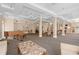 Spacious rec room with piano, seating areas, and high ceilings, offering a versatile and elegant space at 219 4Th N Ave # 201, St Petersburg, FL 33701