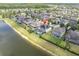 Scenic aerial view of the back of the home with a screened-in pool and waterfront views at 2641 Whittler Br, Odessa, FL 33556