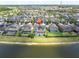 Scenic aerial view of the back of the home, featuring a screened-in pool and waterfront views at 2641 Whittler Br, Odessa, FL 33556