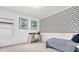Bedroom featuring a desk, a daybed, and black and white geometric wallpaper at 2641 Whittler Br, Odessa, FL 33556