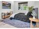 Bedroom with neutral tones, with plush gray rug, and a view from the window at 2641 Whittler Br, Odessa, FL 33556