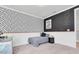 Bedroom featuring a desk, a daybed, black and white geometric wallpaper and a black accent wall at 2641 Whittler Br, Odessa, FL 33556