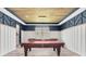 The game room is complete with a pool table, foosball table and custom trim work at 2641 Whittler Br, Odessa, FL 33556