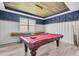 The game room is complete with a pool table, foosball table and custom trim work at 2641 Whittler Br, Odessa, FL 33556