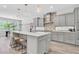 Modern kitchen with stainless steel appliances, a large center island, and pendant lighting at 2641 Whittler Br, Odessa, FL 33556