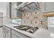 Up close view of the gourmet kitchen with quartz countertop and decorative backsplash at 2641 Whittler Br, Odessa, FL 33556